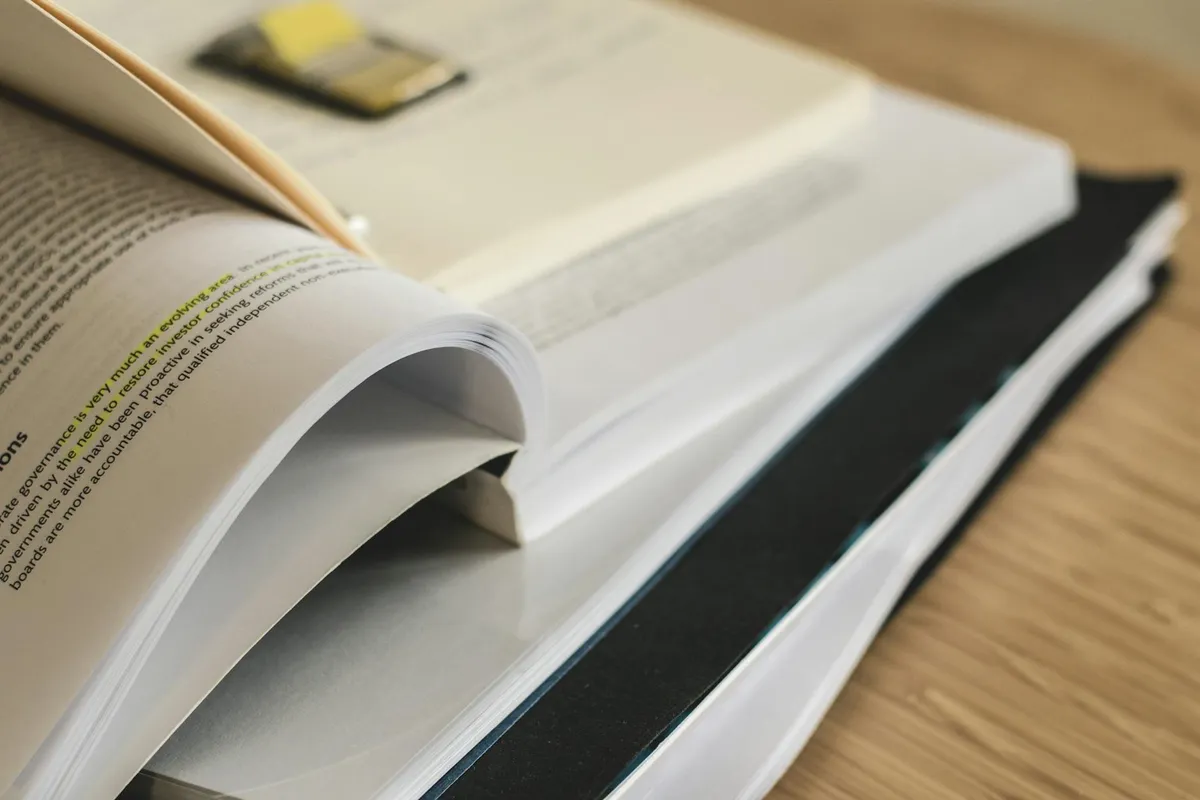 Academic research materials and journals on a desk